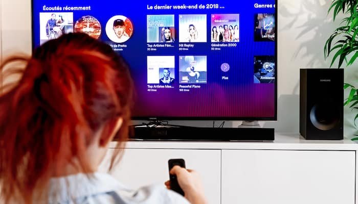 Woman Using a Soundbar