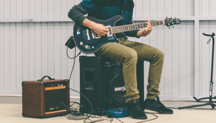 Man sitting on the Amp